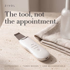 Zivol Glide ultrasonic skin spatula on travertine — the tool, not the appointment