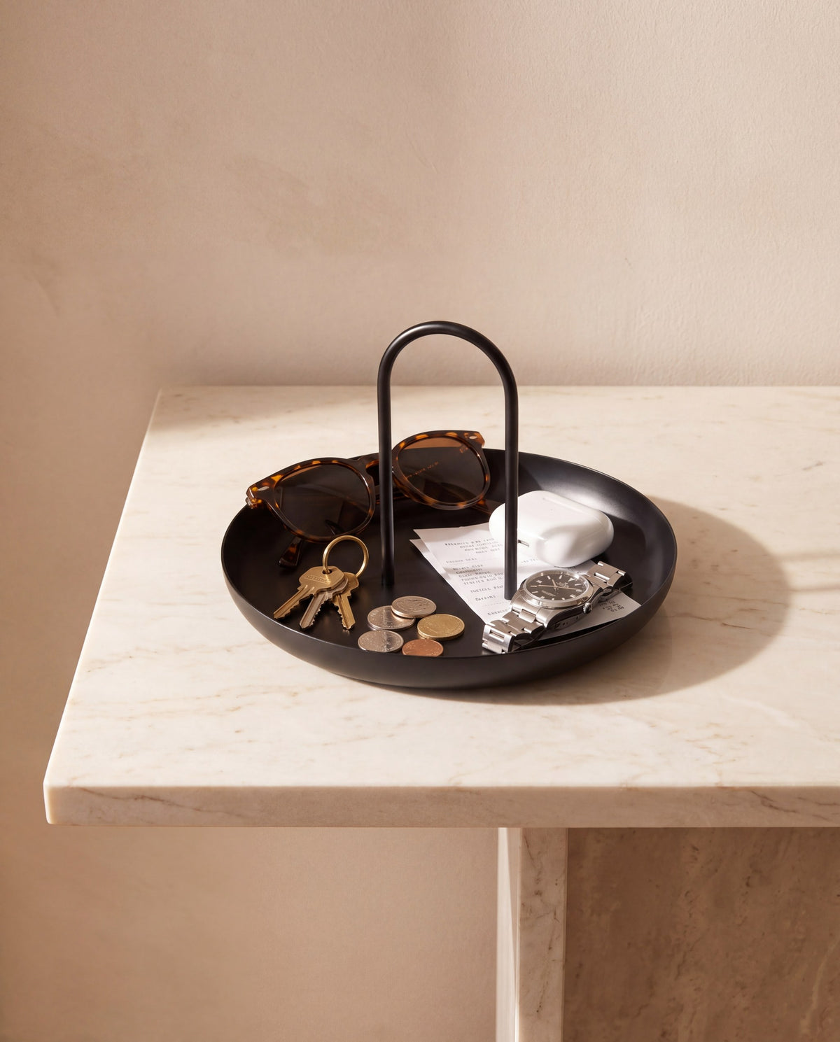 The same objects on the same console, now gathered inside the Zivol Arc tray
