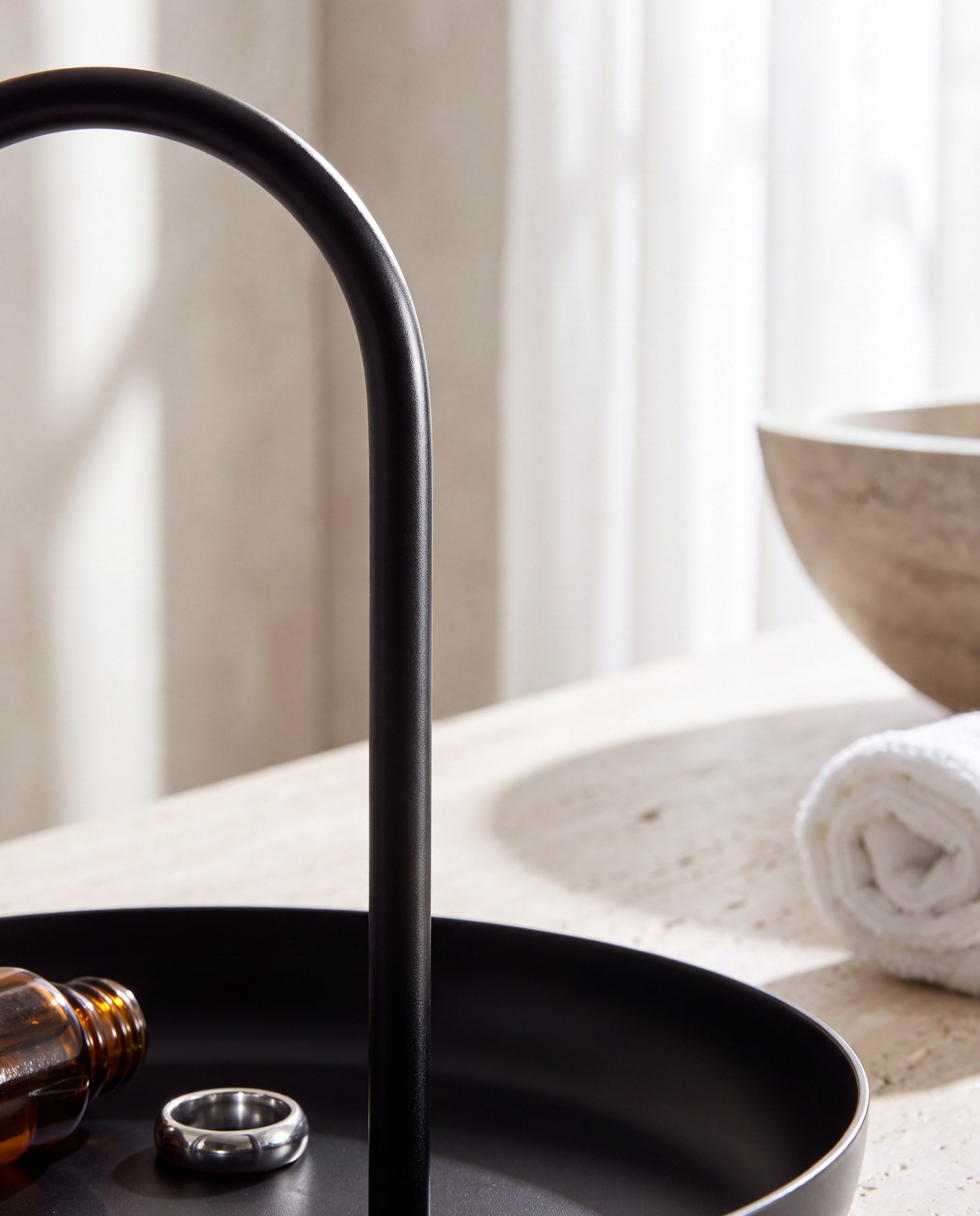 Macro detail of the Zivol Arc anodised aluminium arch in a bright bathroom