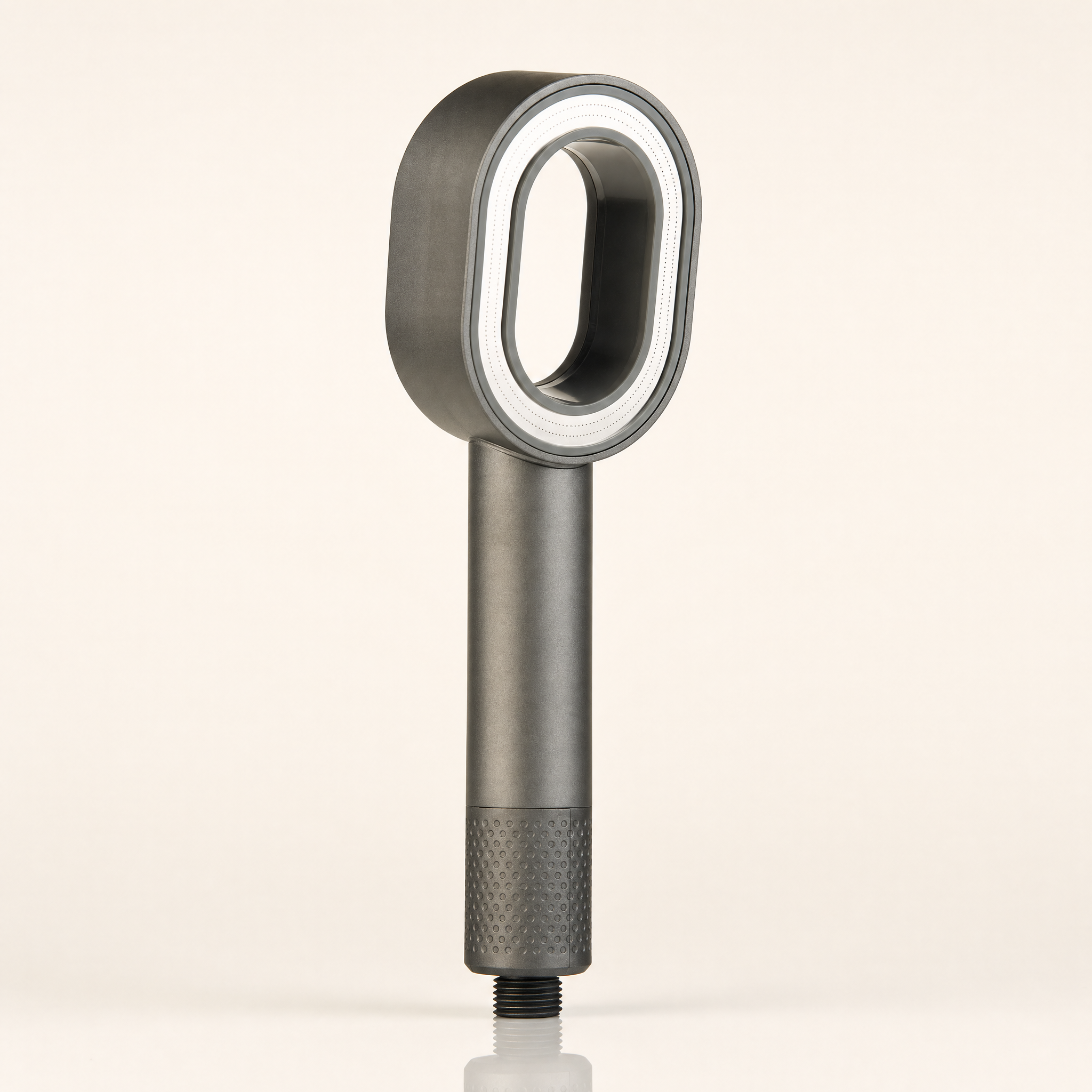 Zivol Pure filtered shower head in Graphite Grey, standing upright on a warm neutral background