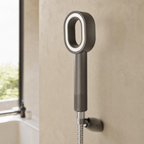 Zivol Pure shower head fitted to a chrome hose in a modern bathroom
