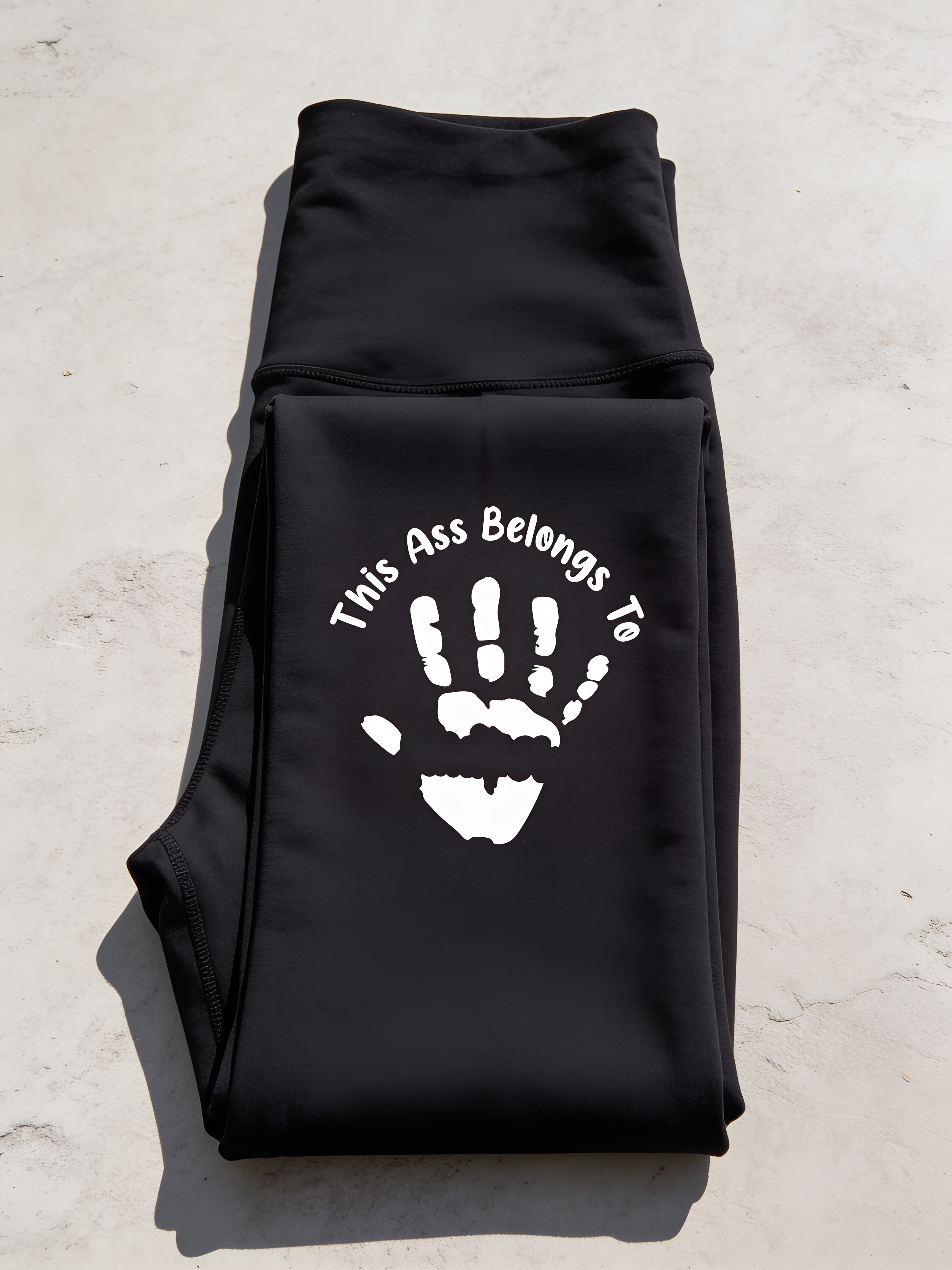 Handprint print shown flat and undistorted on black leggings