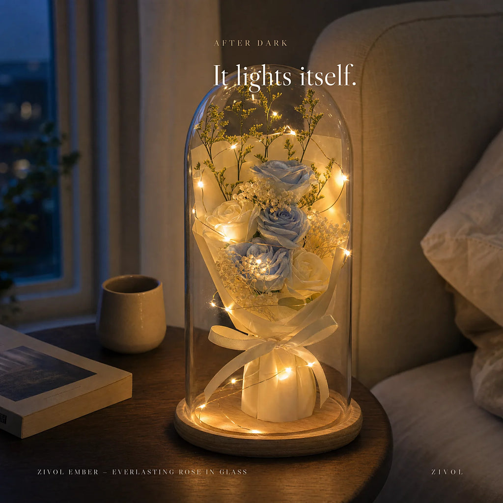 Zivol Ember glowing on a bedside table after dark, warm LEDs lighting the roses