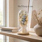Zivol Ember on a living room shelf between books and a ceramic vase