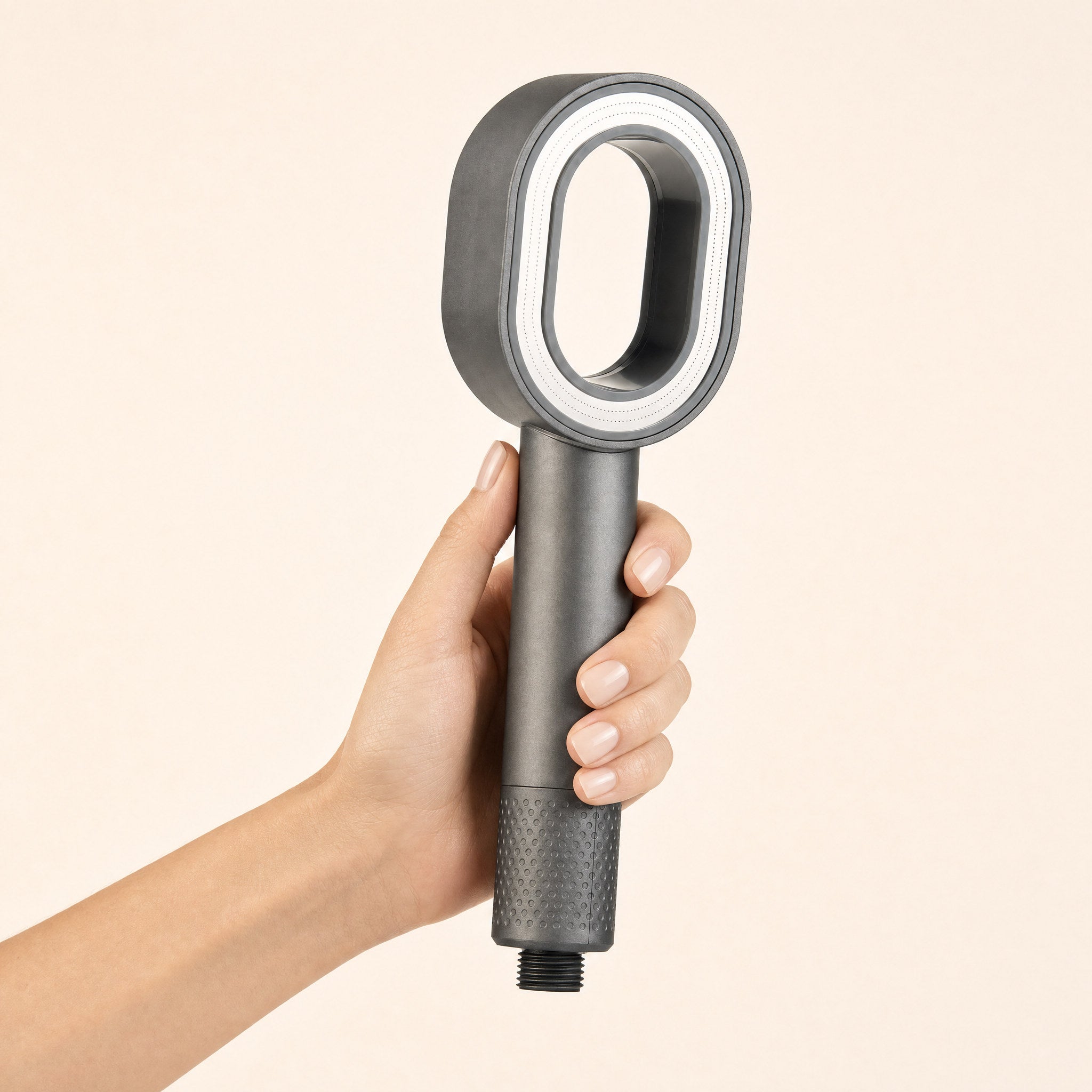Zivol Pure shower head held in hand — the head is about the width of a palm